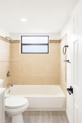 a bathroom with a sink a toilet and a bathtub