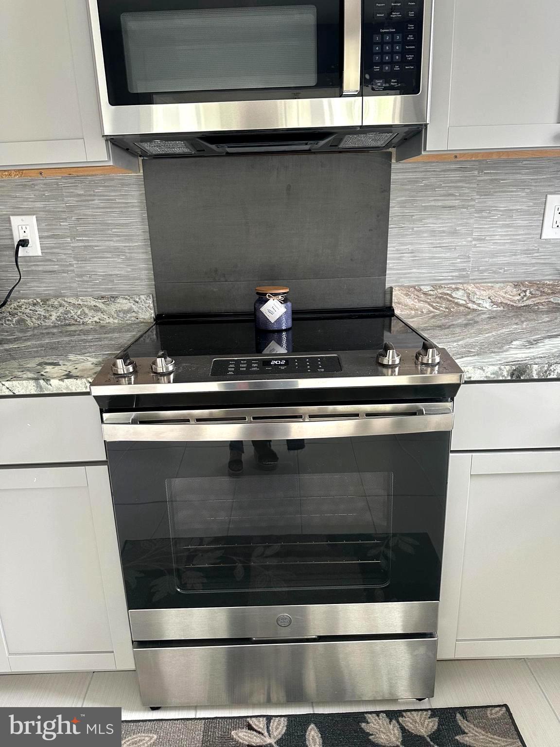 14 Narberth Place Southampton, NJ 08088 - Photo 16 of 33 a stove top oven sitting inside of a kitchen