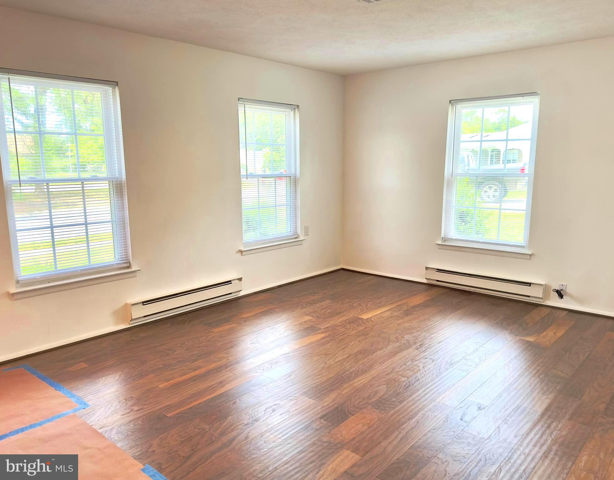 14 Narberth Place Southampton, NJ 08088 - Photo 9 of 33 an empty room with wooden floor and windows
