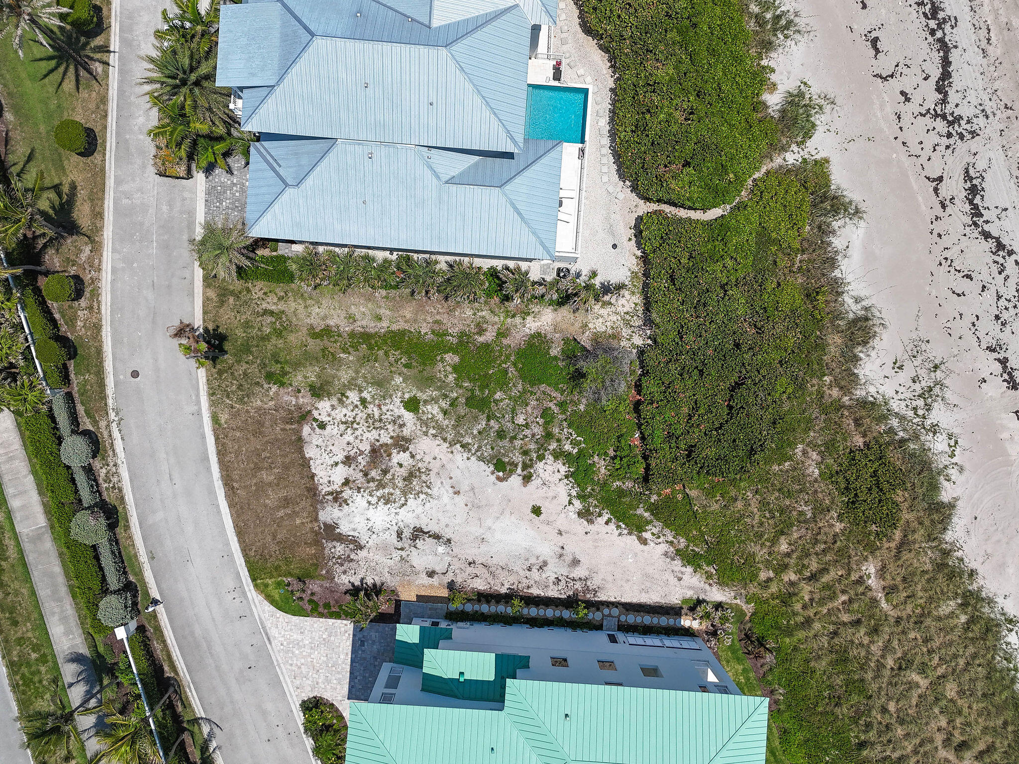 8128 South Ocean Drive Jensen Beach, FL 34957 - Photo 3 of 26 an aerial view of a residential houses with outdoor space