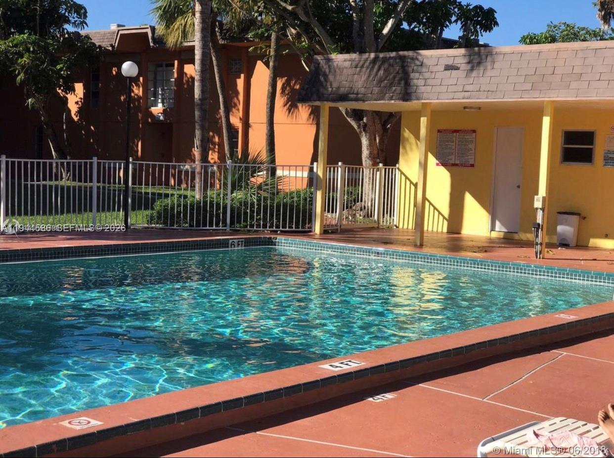 9403 Southwest 76th Street, Unit Y28 Miami, FL 33173 - Photo 18 of 20 a view of outdoor space and yard