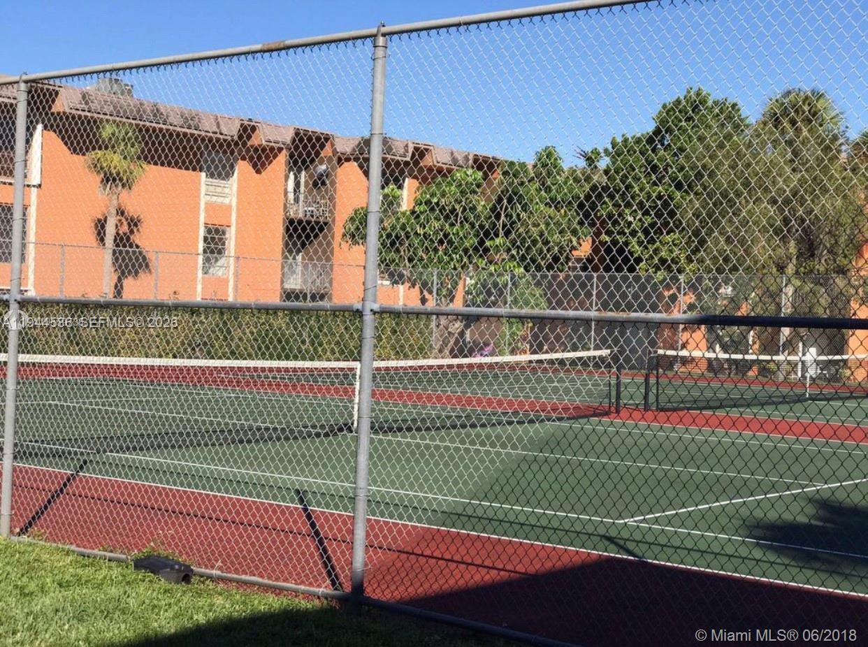 9403 Southwest 76th Street, Unit Y28 Miami, FL 33173 - Photo 20 of 20 a view of a tennis court