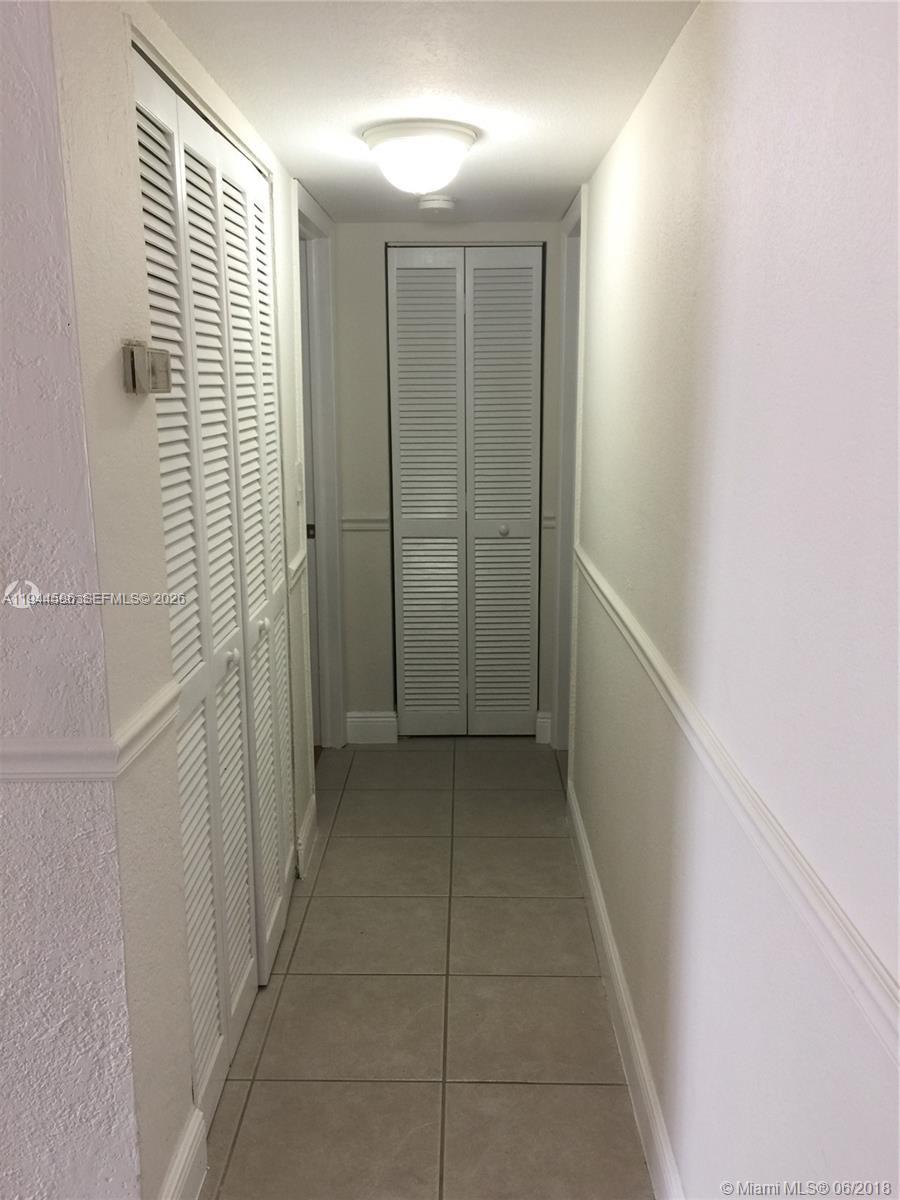9403 Southwest 76th Street, Unit Y28 Miami, FL 33173 - Photo 7 of 20 a view of a hallway