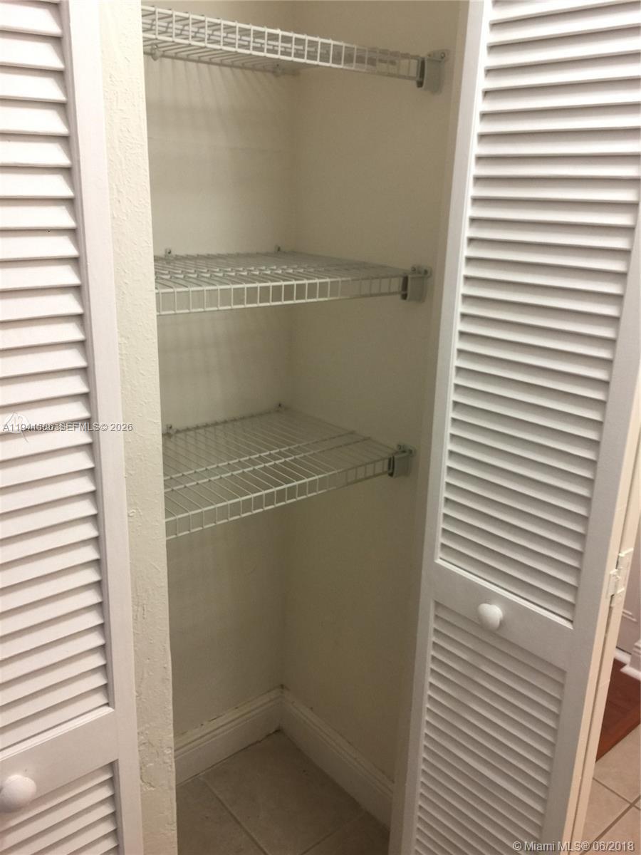 9403 Southwest 76th Street, Unit Y28 Miami, FL 33173 - Photo 8 of 20 a bathroom with a glass shower door