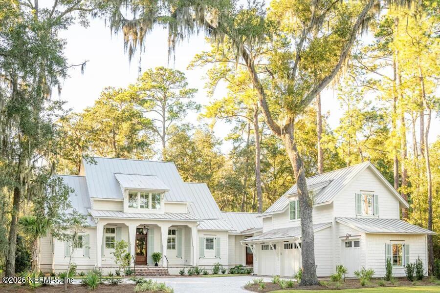 0 Lake Road Jacksonville, FL 32226 - Photo 1 of 20 a view of a white house next to a large tree