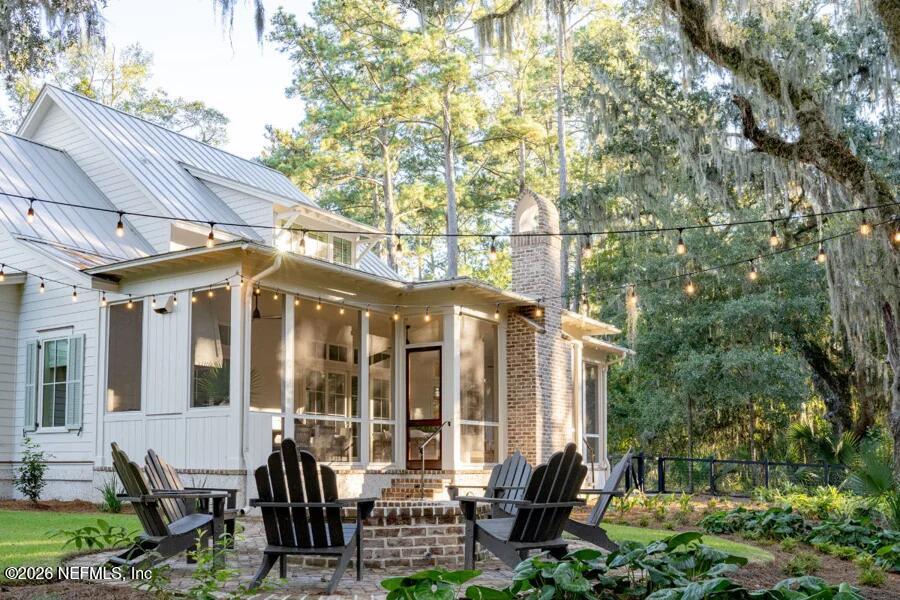 0 Lake Road Jacksonville, FL 32226 - Photo 15 of 20 a front view of a house with outdoor seating and trees