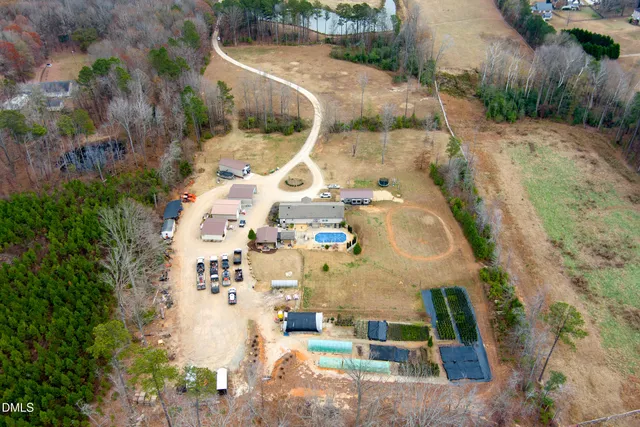 an aerial view of residential house with outdoor space