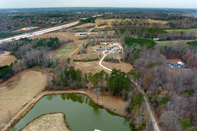 an aerial view of a house with a lake view
