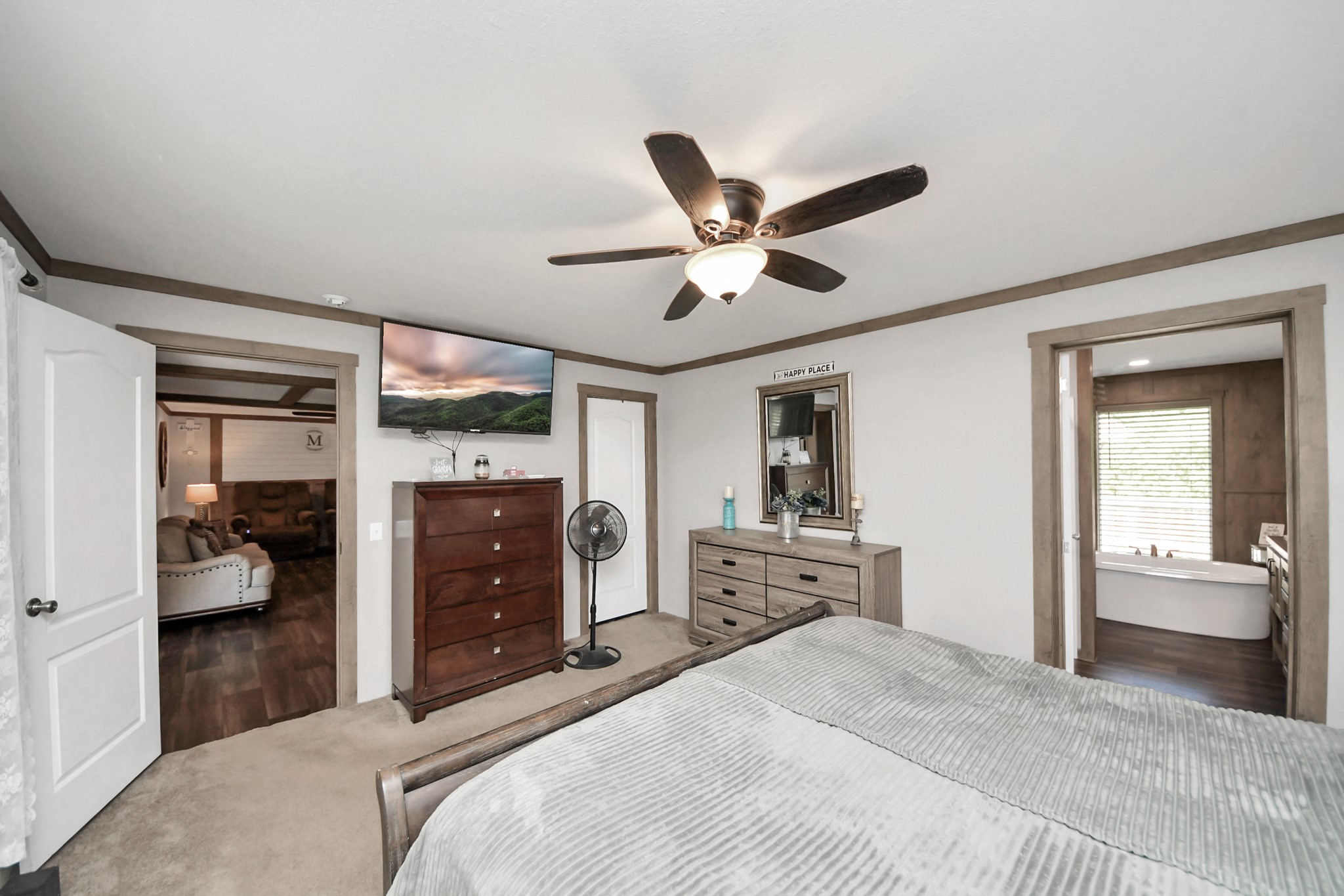 131 Kiowa Court Rosharon, TX 77583 - Photo 18 of 42 This cozy primary bedroom features soft carpet, neutral walls, and a walk in closet. The window allows plenty of natural light