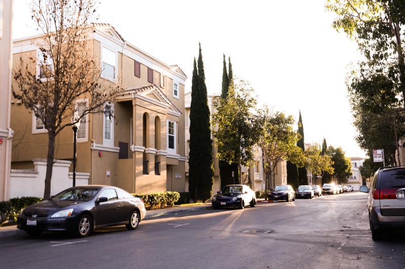190 Rainbow Place Milpitas, CA 95035 - Photo 14 of 18 a couple of cars parked in front of a big yard
