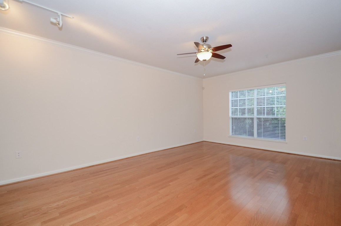 9200 Westheimer Road, Unit 802 Houston, TX 77063 - Photo 12 of 32 wooden floor in an empty room with a window