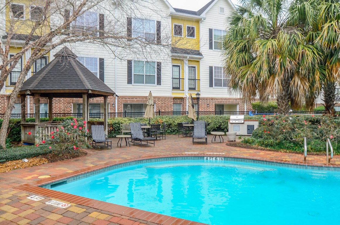 9200 Westheimer Road, Unit 802 Houston, TX 77063 - Photo 31 of 32 a view of pool with outdoor seating