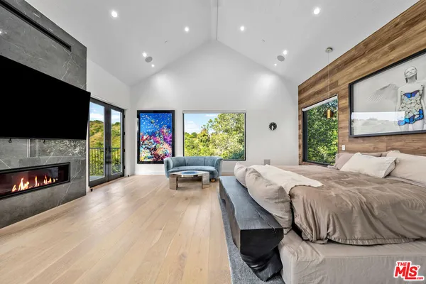 a white bath tub sitting in front of a window