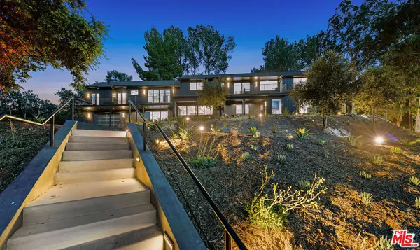 a view of house with a yard