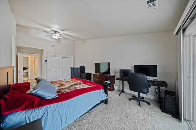 a large bathroom with a double vanity sink and a large mirror