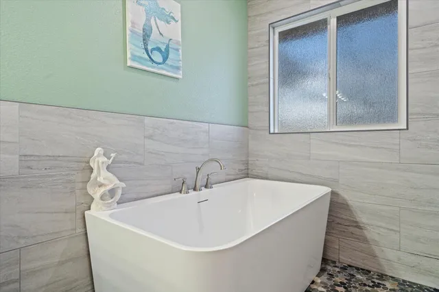 a bed room with a bed and a chandelier