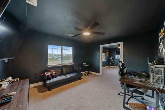 a view of an empty room with windows