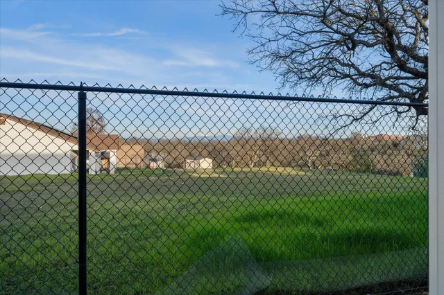 a view of a house with backyard and garden