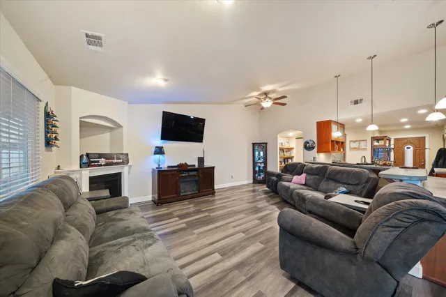 a view of a dining room with furniture and wooden floor