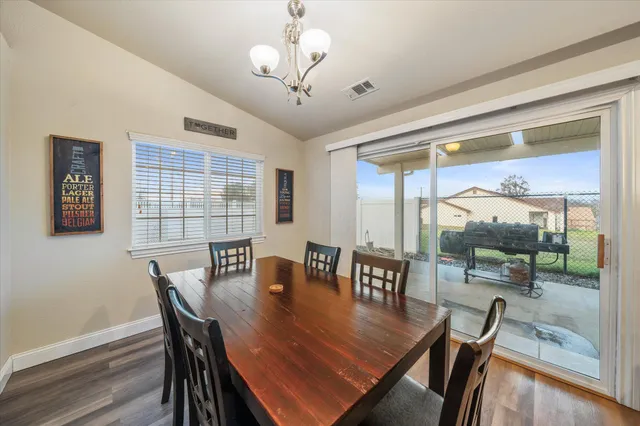 a kitchen with kitchen island a counter space a sink appliances and cabinets