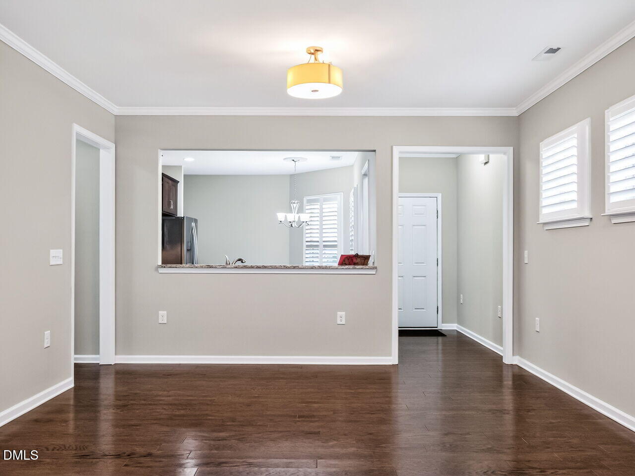 123 Merganser Way Durham, NC 27703 - Photo 11 of 37 a view of an empty room with wooden floor and a window