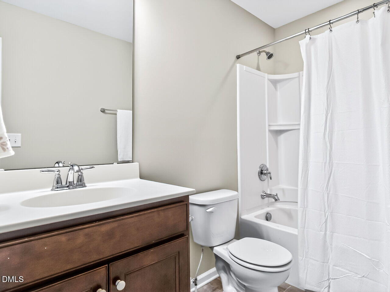123 Merganser Way Durham, NC 27703 - Photo 25 of 37 a bathroom with a sink a toilet and shower