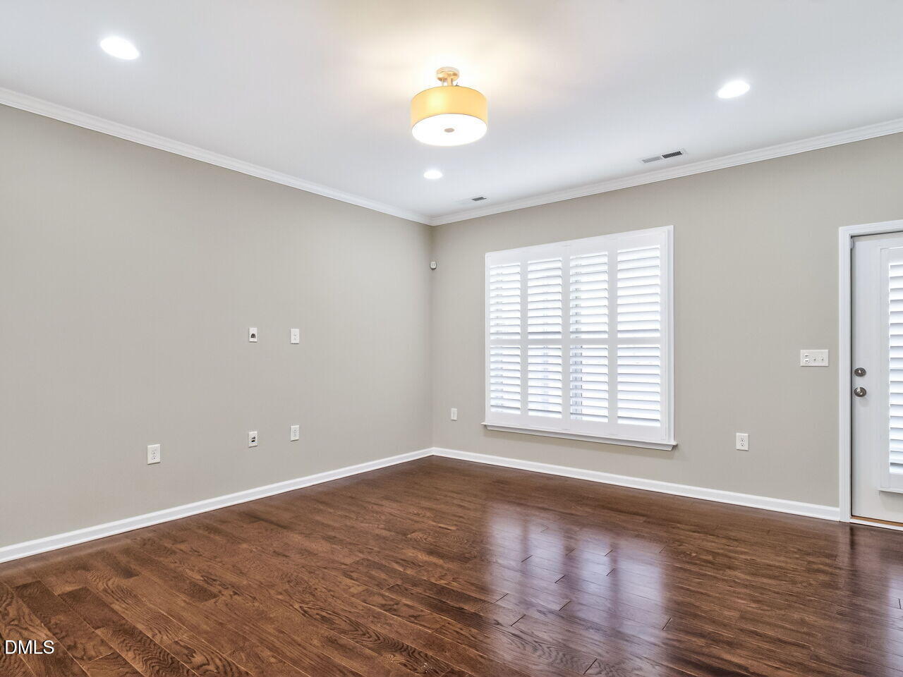 123 Merganser Way Durham, NC 27703 - Photo 6 of 37 a view of an empty room with wooden floor and a window