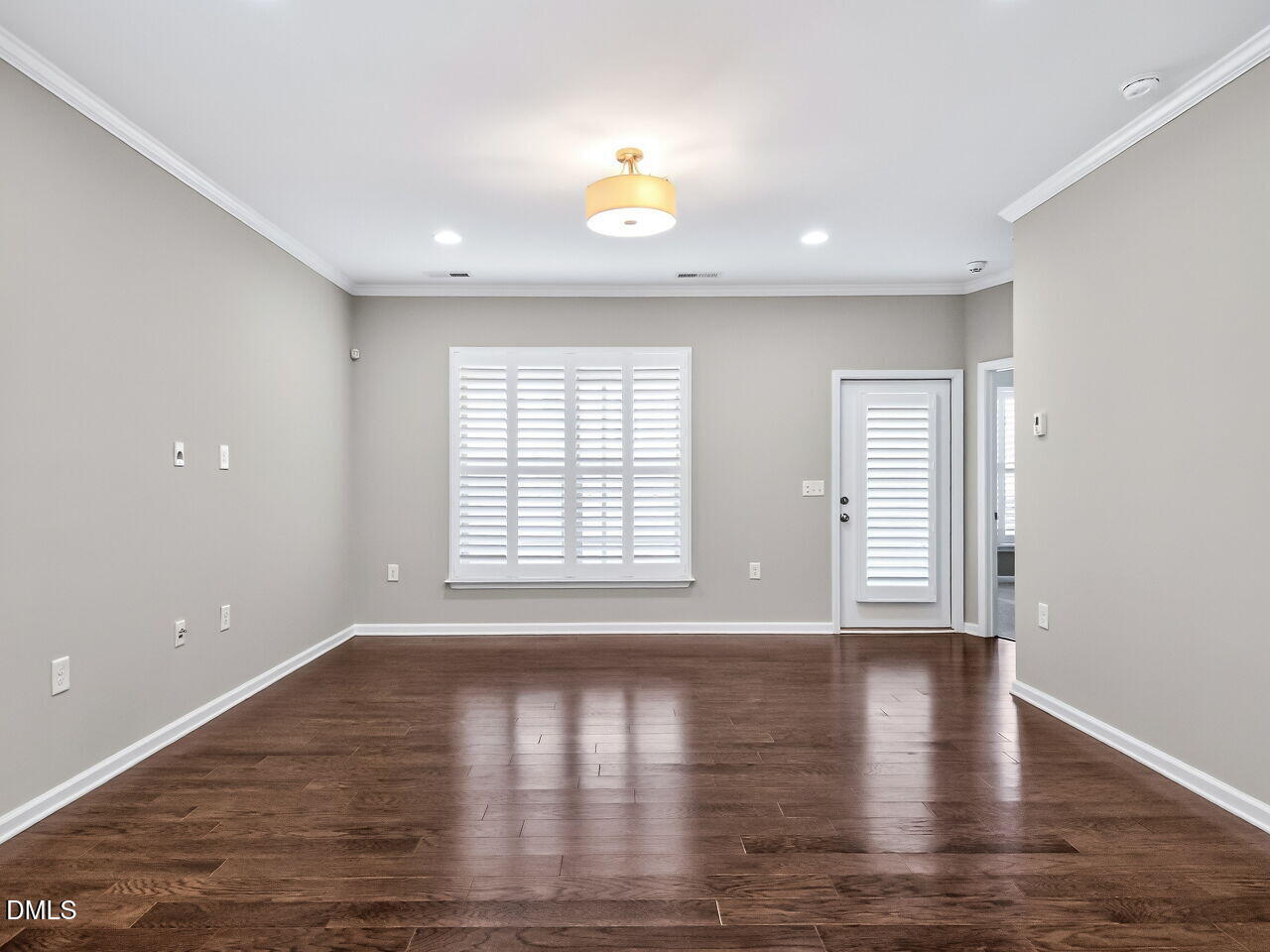 123 Merganser Way Durham, NC 27703 - Photo 7 of 37 a view of an empty room with wooden floor and a window