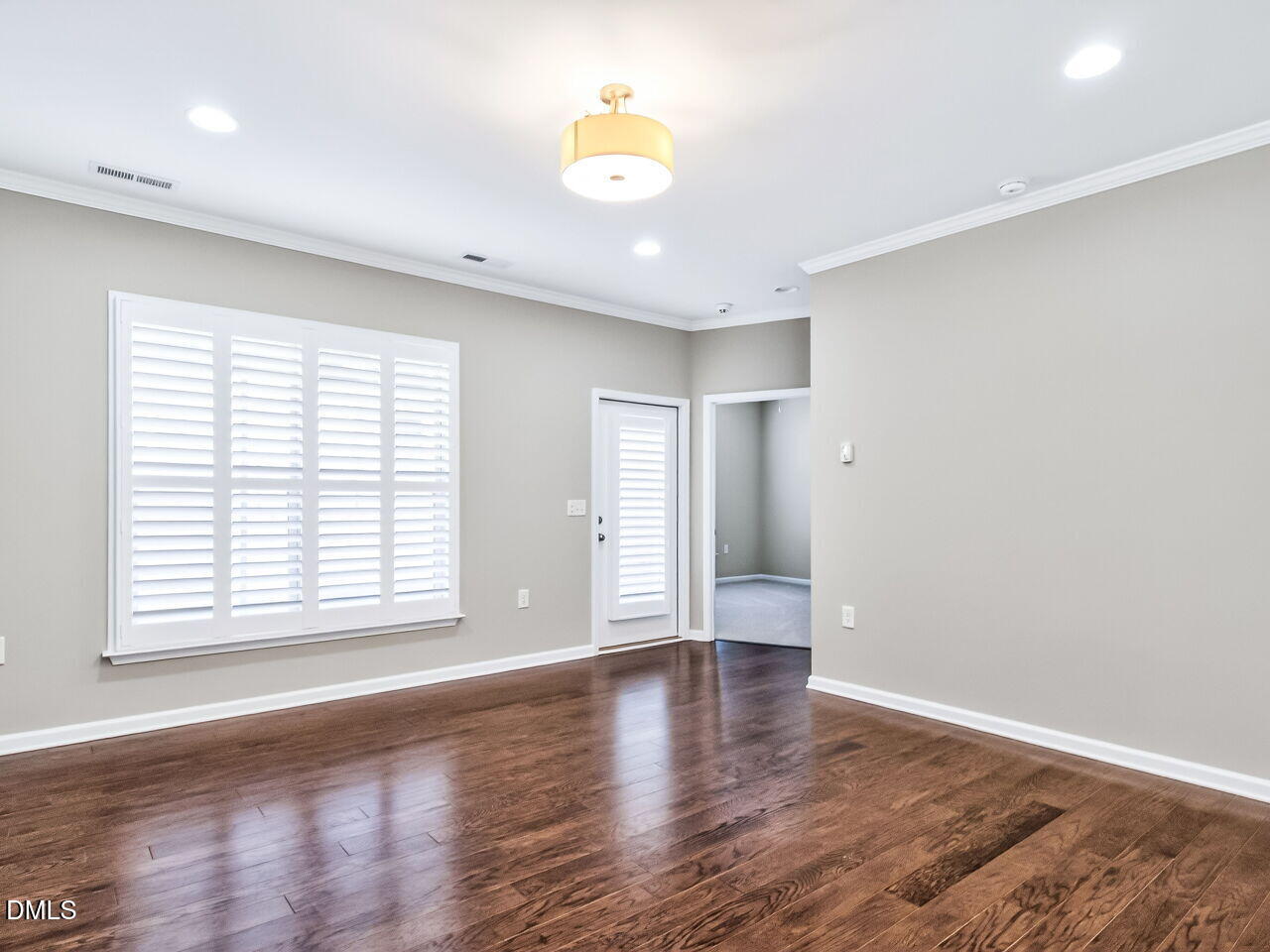123 Merganser Way Durham, NC 27703 - Photo 8 of 37 an empty room with wooden floor and windows