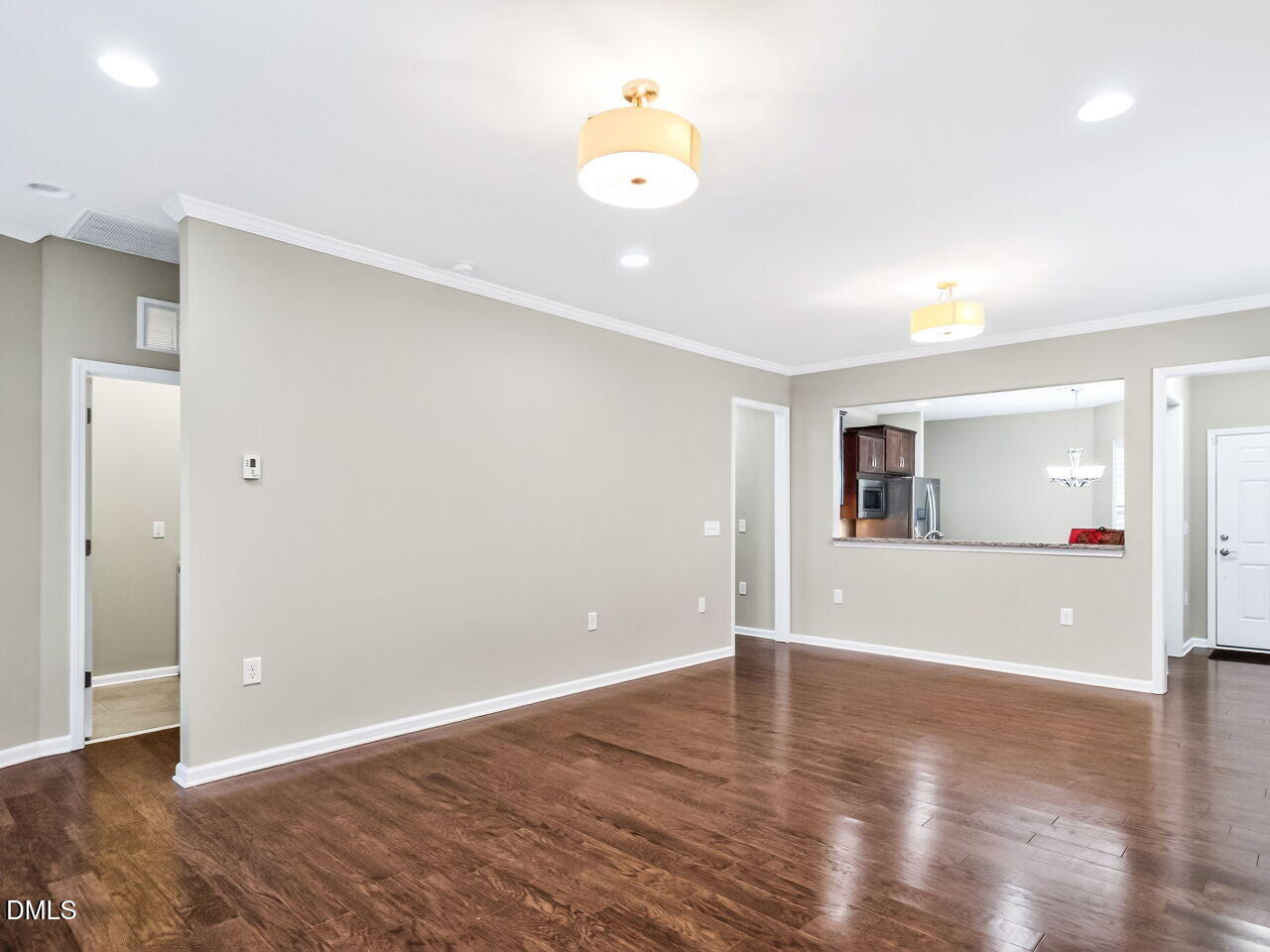 123 Merganser Way Durham, NC 27703 - Photo 9 of 37 a view of an empty room with wooden floor and a window