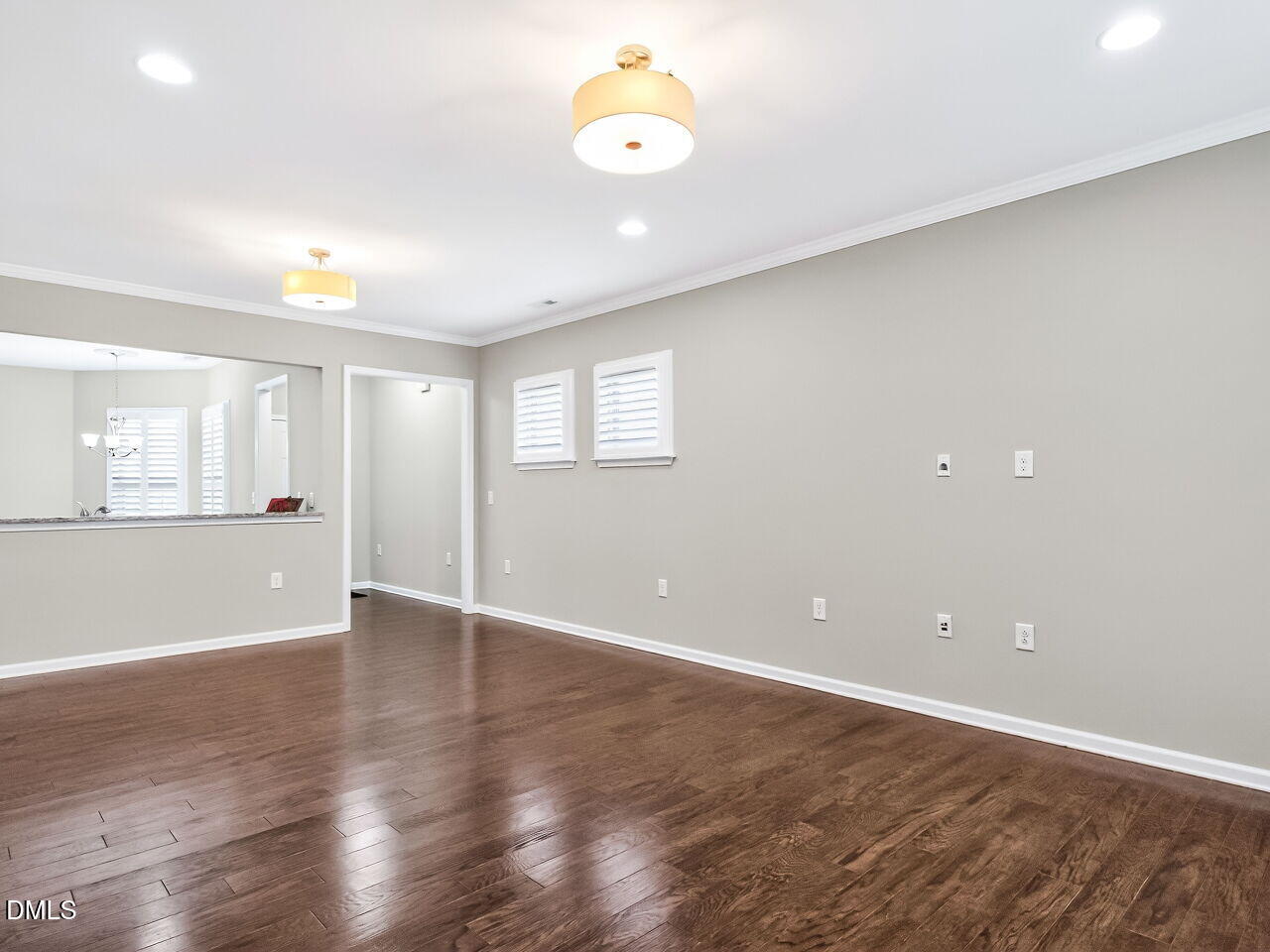 123 Merganser Way Durham, NC 27703 - Photo 10 of 37 an empty room with wooden floor and windows