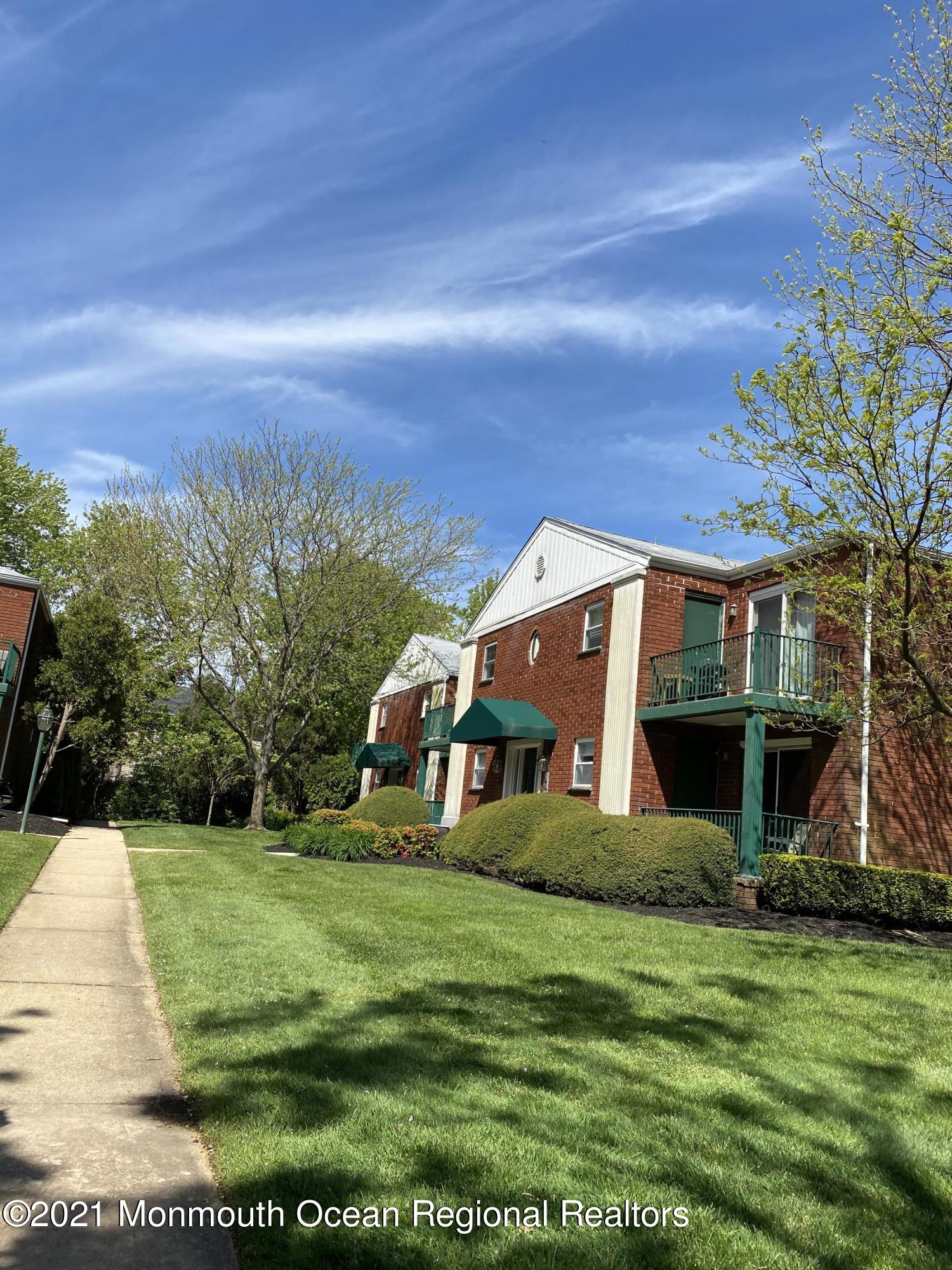 65 Cedar Avenue, Unit C4 Long Branch, NJ 07740 - Photo 2 of 10 a view of a house with a big yard