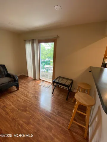 a view of a chairs and table in the patio
