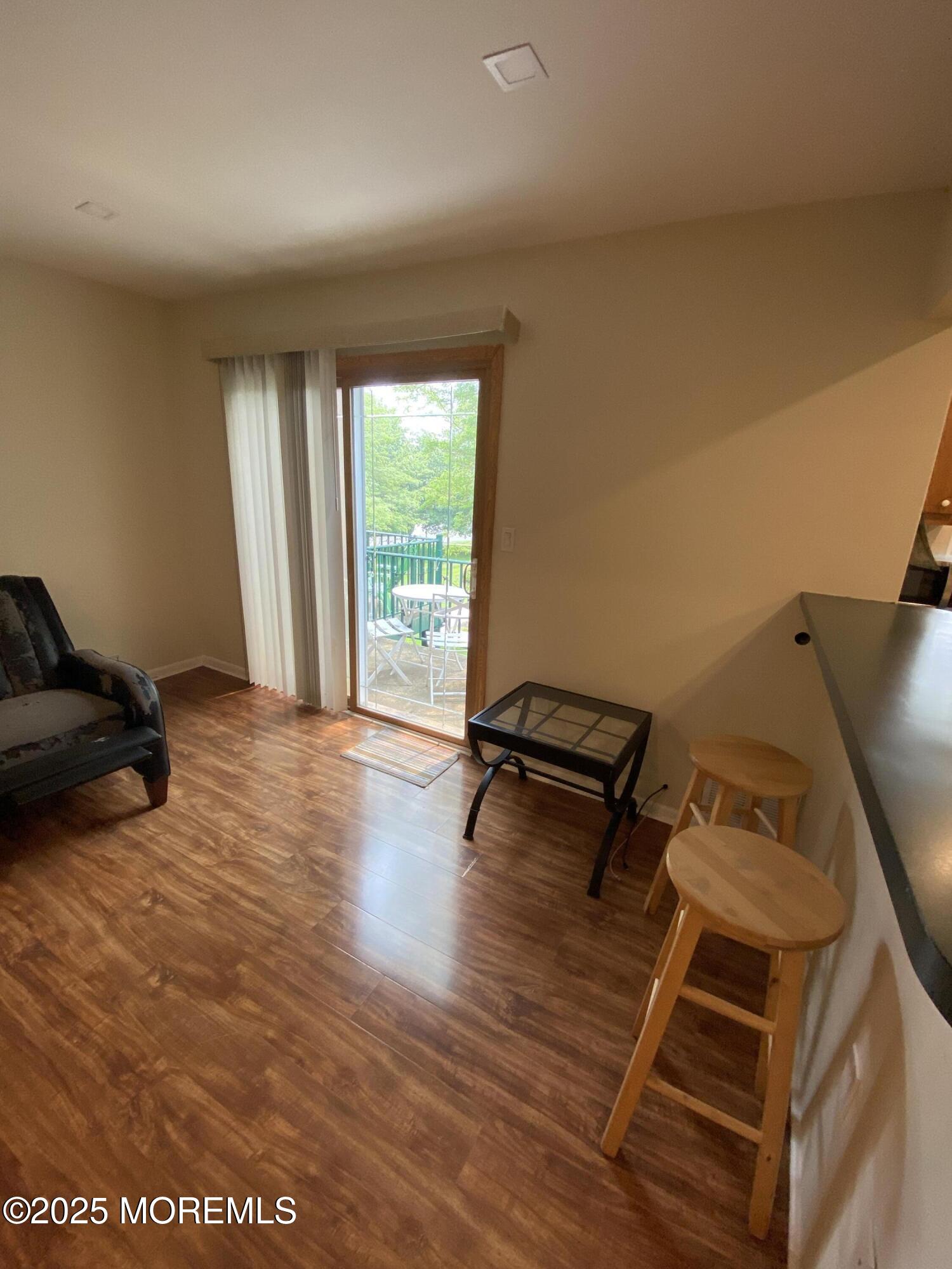 65 Cedar Avenue, Unit C4 Long Branch, NJ 07740 - Photo 5 of 10 a living room with furniture and a wooden floor