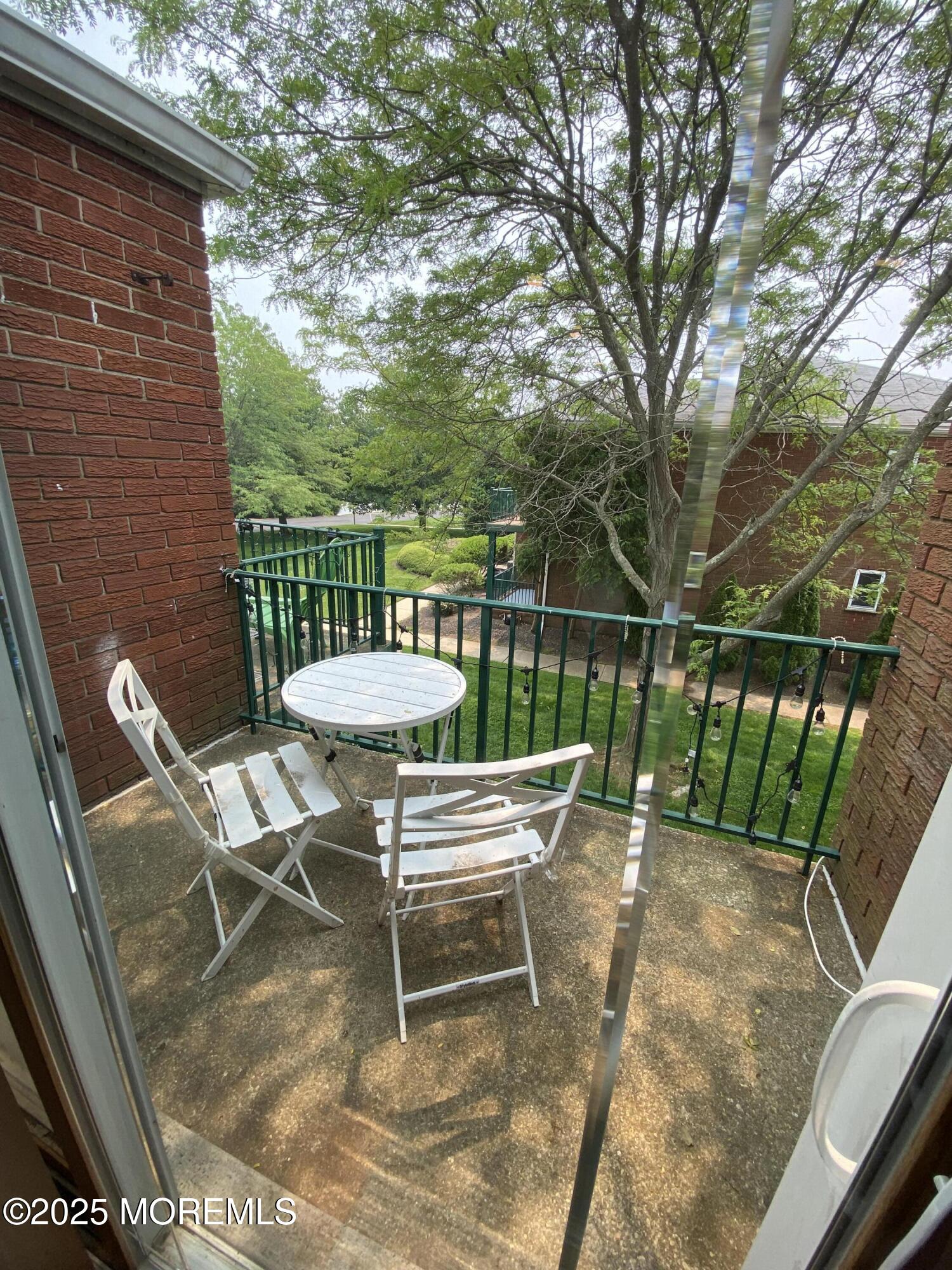 65 Cedar Avenue, Unit C4 Long Branch, NJ 07740 - Photo 6 of 10 a view of a chairs and table in the patio