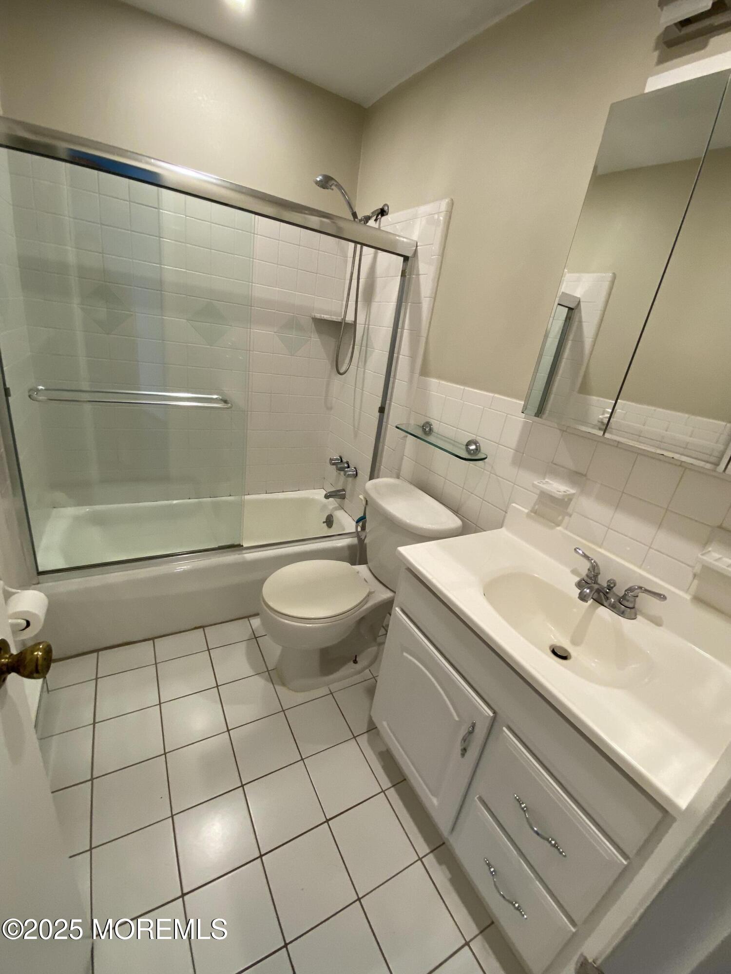65 Cedar Avenue, Unit C4 Long Branch, NJ 07740 - Photo 9 of 10 a bathroom with a sink toilet and shower