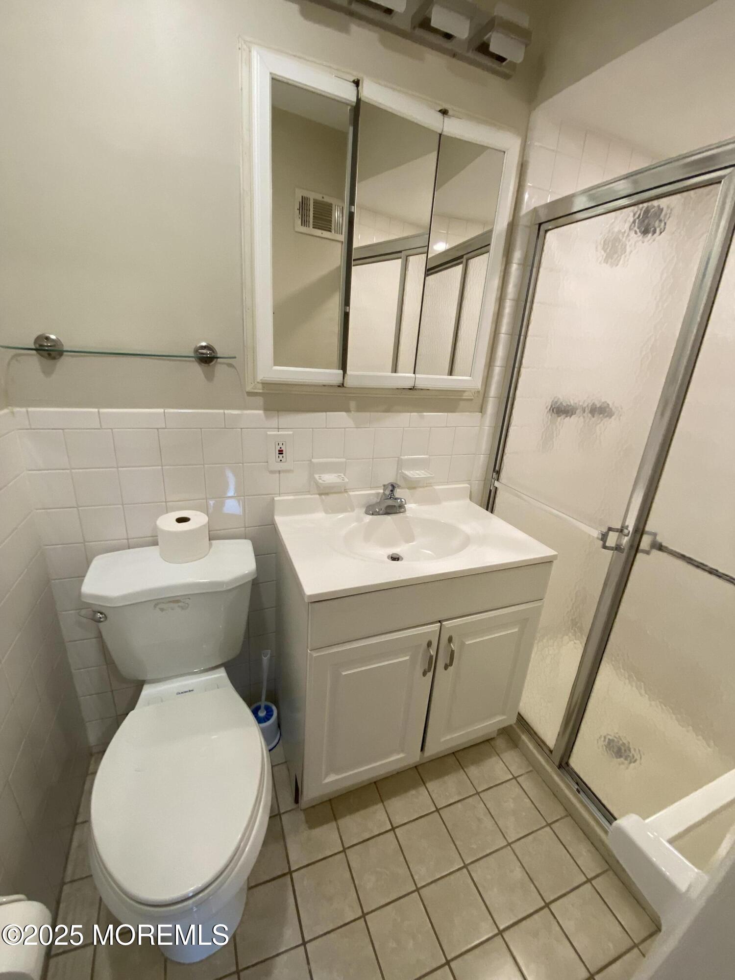 65 Cedar Avenue, Unit C4 Long Branch, NJ 07740 - Photo 10 of 10 a bathroom with a sink toilet and mirror