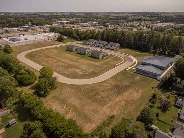 an aerial view of a house with outdoor space