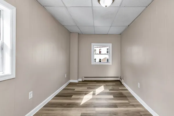 a view of a hallway with a window