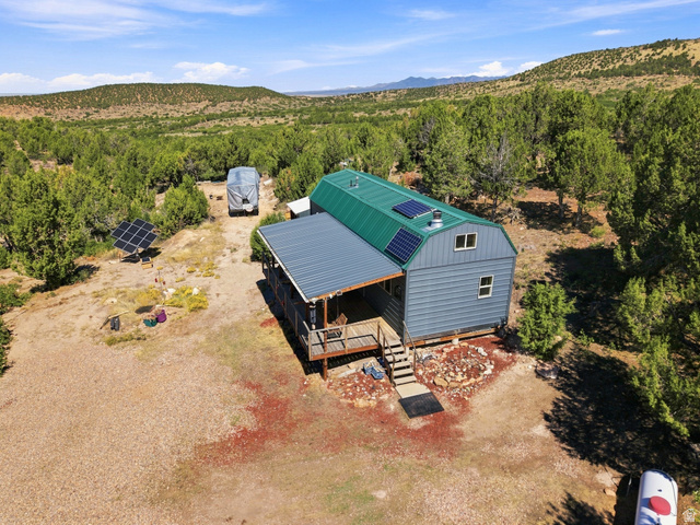 2345 East Frampton Hts Road, Unit 12 Fillmore, UT 84631 - Photo 23 of 31 Barn-style structure with a green metal roof and solar panels