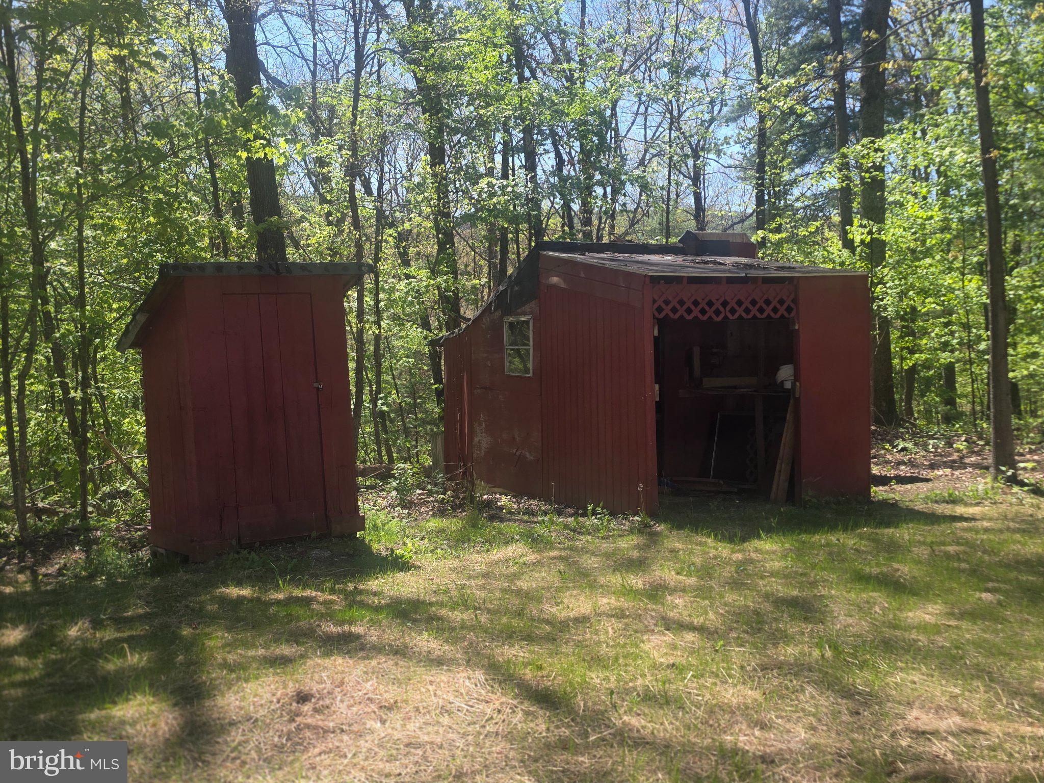 357 Gunsmoke Road Warfordsburg, PA 17267 - Photo 6 of 23 Charming red sheds nestled in nature.