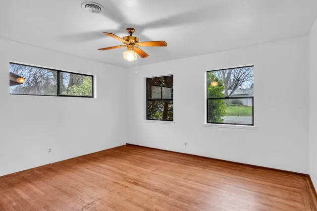 a view of room with window and ceiling fan