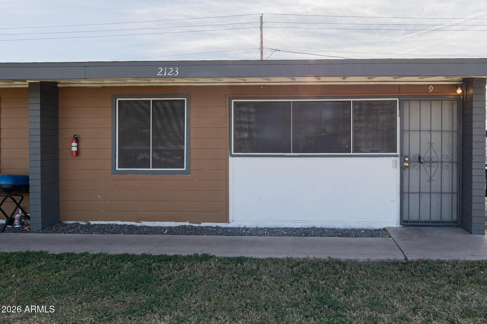 2123 West Devonshire Avenue, Unit 9 Phoenix, AZ 85015 - Photo 1 of 12 a front view of a house