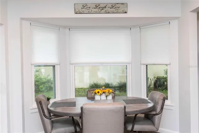 a close view of a sink and a refrigerator in a room