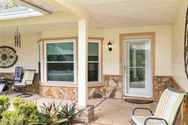 a view of entryway with a table and a chair