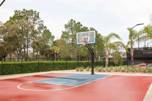 a room with furniture pool table and windows