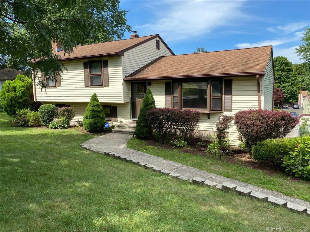 264 Anns Farm Road Hamden, CT 06518 - Photo 1 of 1 a front view of a house with a garden