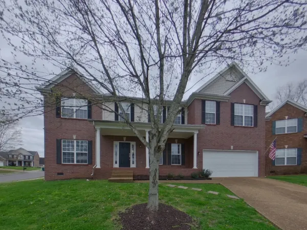 front view of house with a yard