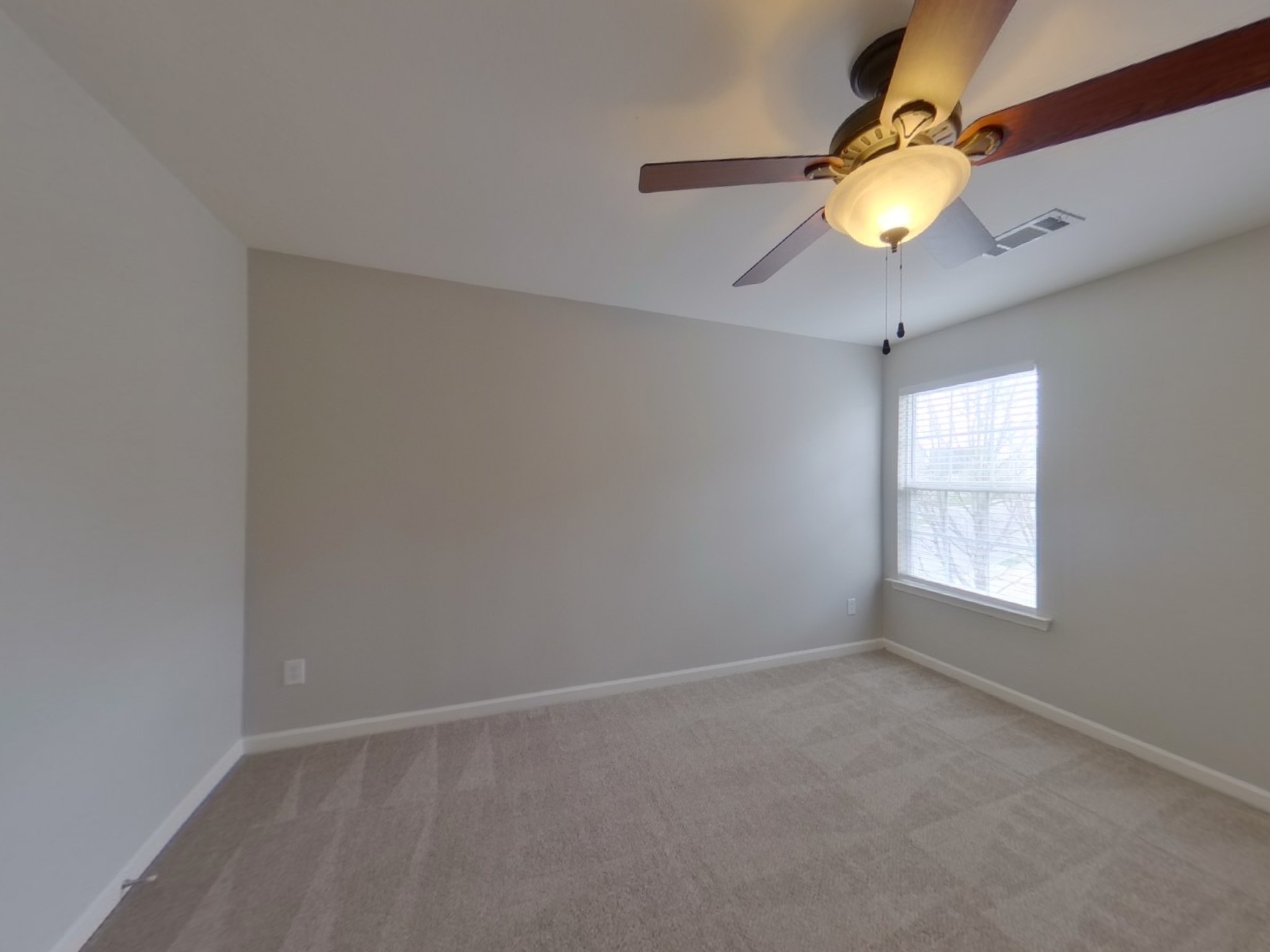 5001 Burtonwood Way Spring Hill, TN 37174 - Photo 11 of 20 an empty room with window and chandelier fan