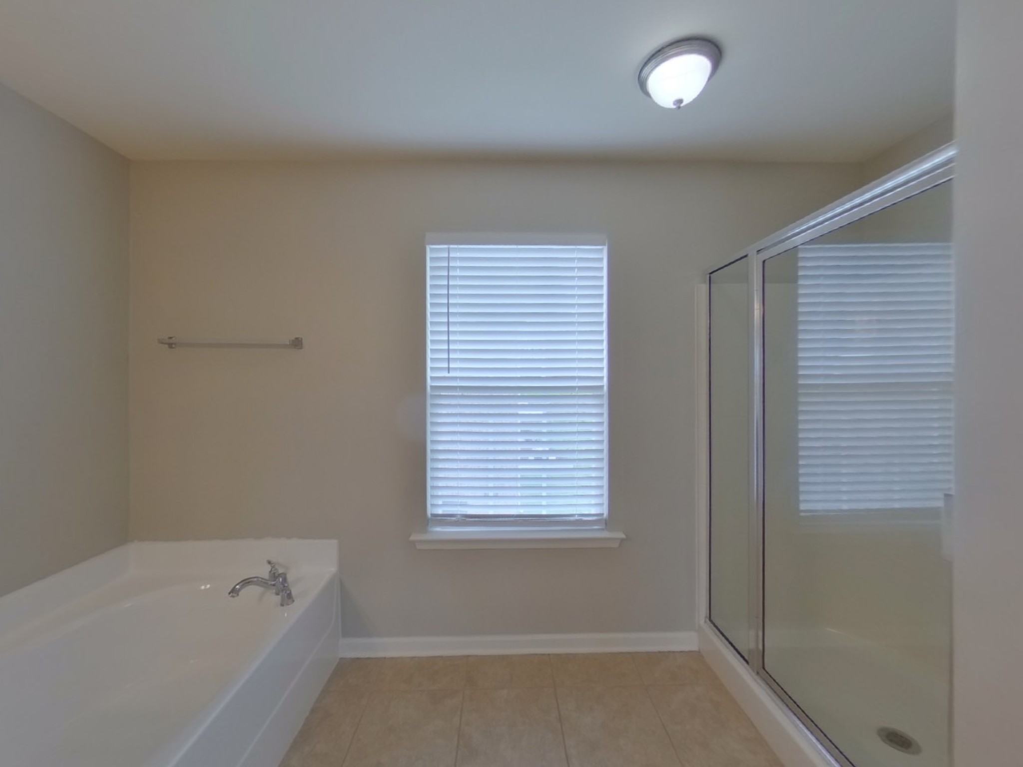 5001 Burtonwood Way Spring Hill, TN 37174 - Photo 10 of 20 a bathroom with a bathtub and a window
